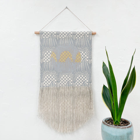 Grey Gateway with Taupe Circle and Gold Wall Hanging